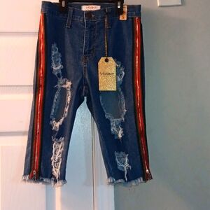 Vibrant brand size small distressed blue jean bermudas.